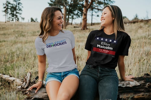 Two friends sitting a chatting with political t-shirts on