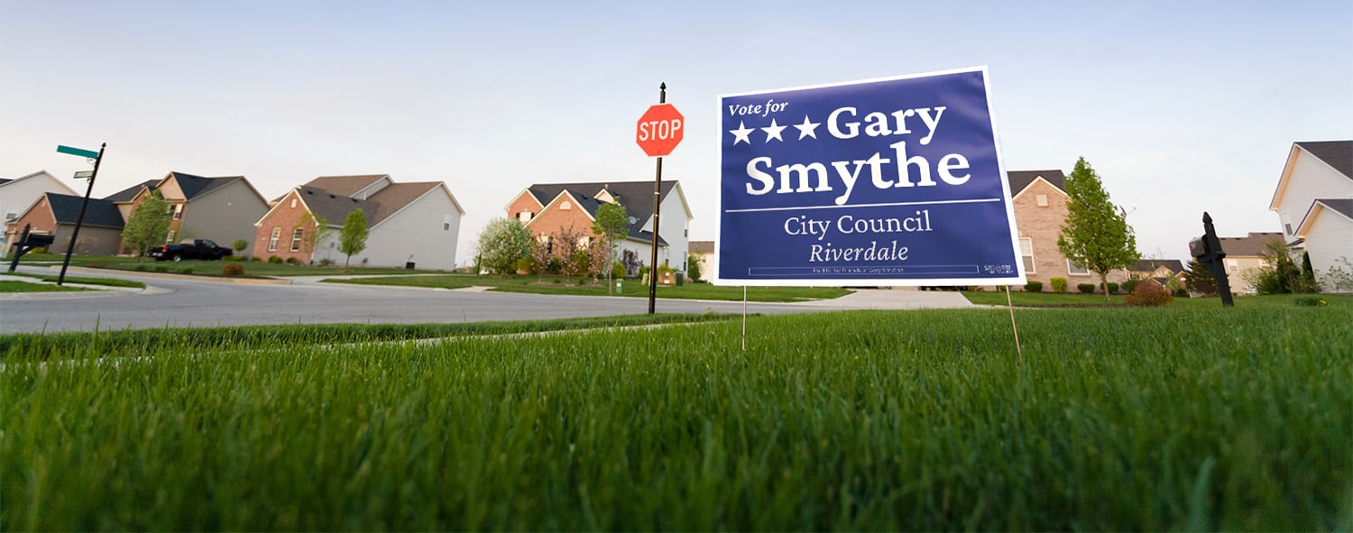 Yard sign in suburban neighborhood