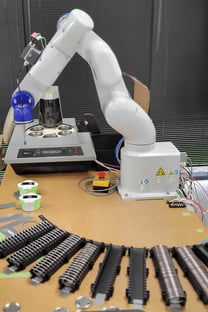 Robot that makes pinback buttons at MerchBlue